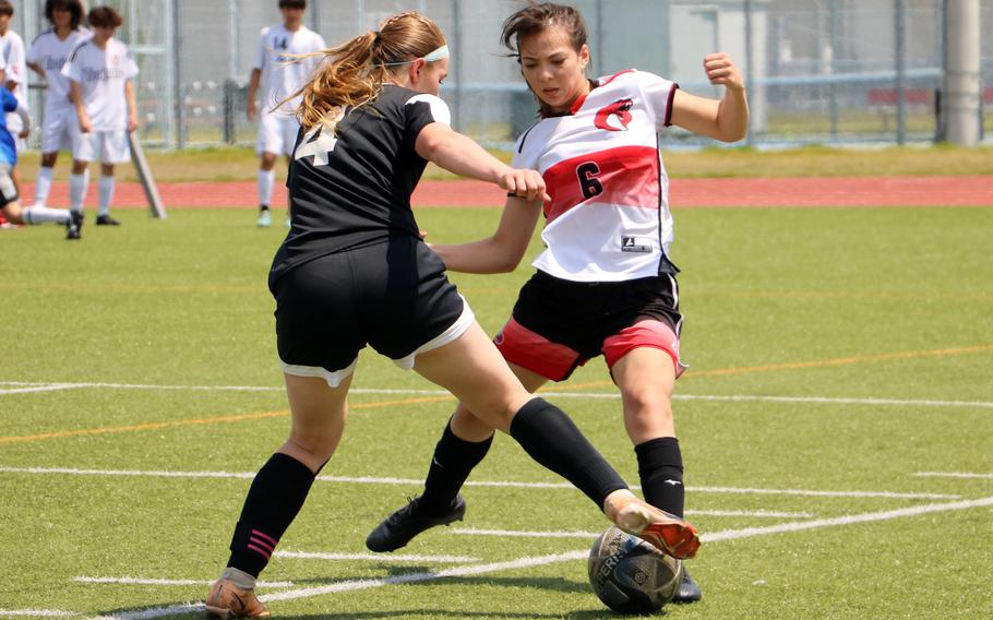Bella Hunter tries to get past Eileen McKown.
