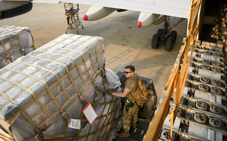 Staff Sgt. Colton Panizo, an air freight supervisor deployed to Incirlik Air Base, Turkey, unloads pallets of humanitarian aid meant for earthquake survivors in Turkey. The Feb. 6 quakes have left at least 46,000 dead in Turkey and Syria.
