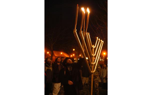 RAF Mildenhall, England, Dec. 27, 2005: Rabbi Moshe Mueller lights three candles on the traditional Jewish menorah at a ceremony at RAF Mildenhall, held on the third day of Hanukkah. Mueller traveled from London to be part of the short ceremony, attended by about 30 people. Today - Dec. 7, 2023 - is the first day of Hannukah.Hanukkah sameach!to all our readers who celebrate.

META TAGS: Judaism; faith; Hanukkah; 