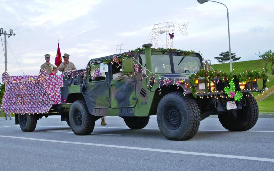 Marines got into the Christmas spirit at Camp Kinser’s parade in Okinawa, Japan, Dec. 1, 2004, as they decorated this Humvee and trailer for the occasion.