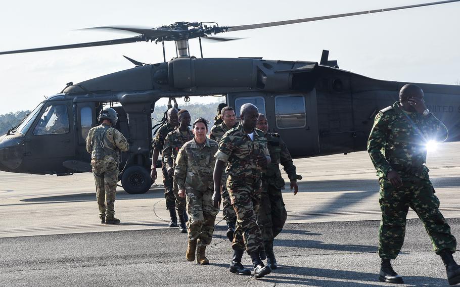 U.S. and African military officials exit a UH-60 Black Hawk helicopter after a ride above Fort Benning, Ga., March 22, 2022, during the U.S. Army’s African Land Forces Summit.