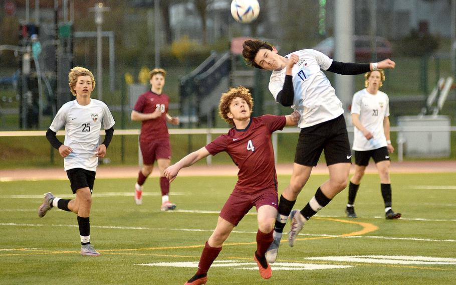 Stuttgart’s Gabe Tamez goes up for a ball while Lakenheath midfielder Joshua Gabel jostles during a match at Kaiserslautern High School in Kaisersalutern, Germany.