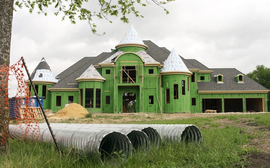 The shell of the Dallas dream home, as of May 3. Rising costs from factors in the COVID economy made the homebuilding slower and more expensive than the owners, builders and suppliers had thought. 