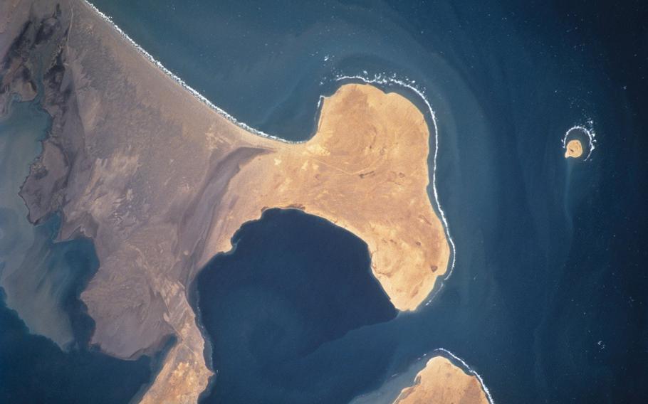 The rugged, rocky, sandy desert landscape of the west coast of Yemen is visible in this near-vertical view, photographed from the Earth-orbiting Space Shuttle Atlantis during the STS-110 mission. 