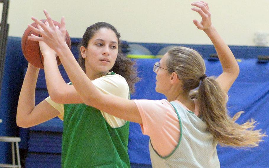 Junior Sophia Grubbs (volleyball) and sophomore Lillian Law (tennis) are trying basketball for the first time for Kubasaki.