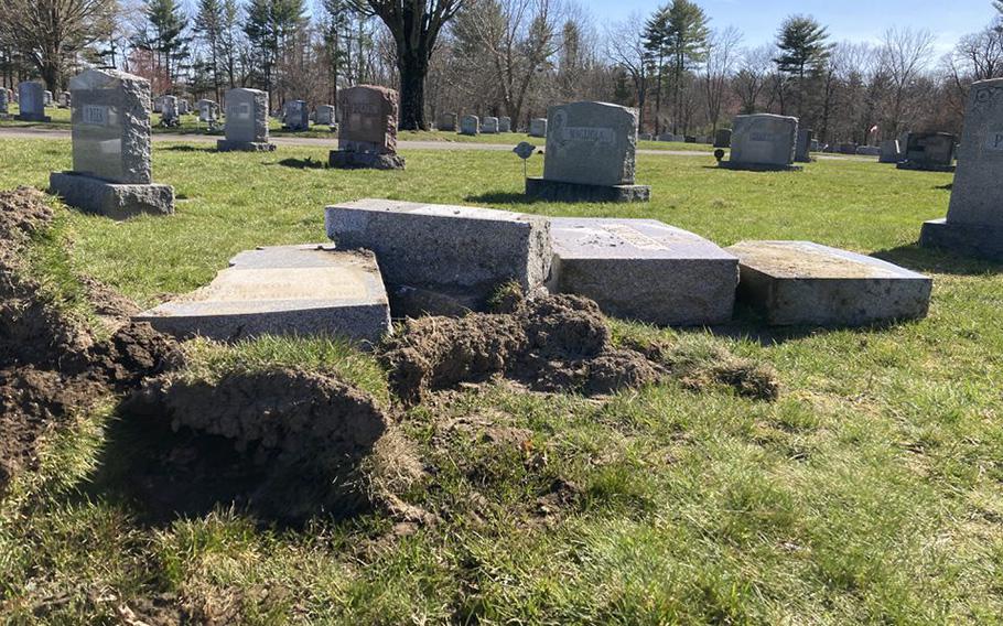 A driver crashed off Bridge Road into St. Mary Cemetery in Northampton before dawn on Saturday, April 8, damaging nearly 20 gravestones. (Will Katcher/MassLive).