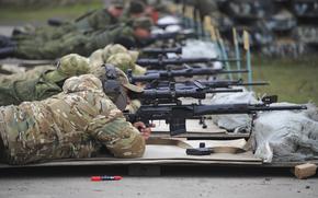 Recruits fire from their sniper's rifles during a military training at a firing range in the Rostov-on-Don region in southern Russia, Tuesday, Oct. 4, 2022. Russian Defense Minister Sergei Shoigu said that the military has recruited over 200,000 reservists as part of a partial mobilization launched two weeks ago. 