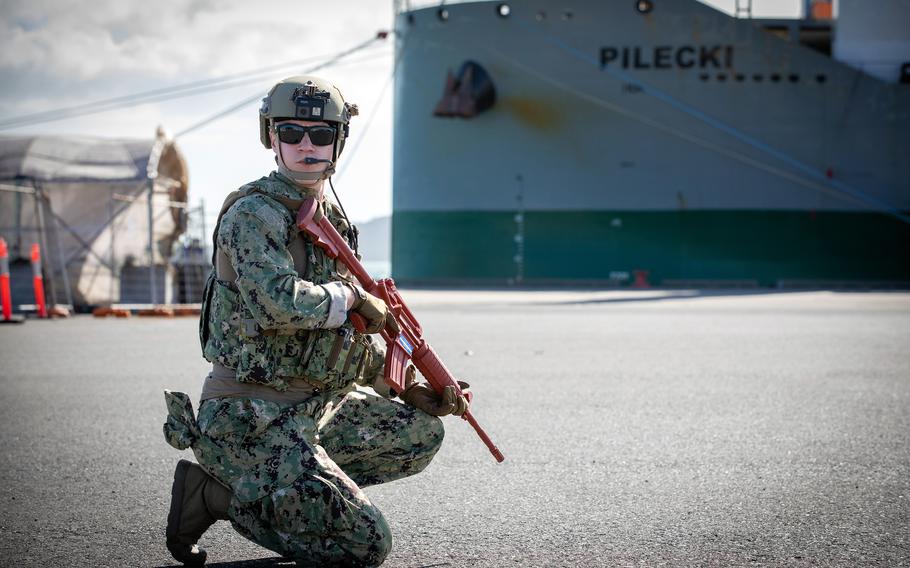 Members of the U.S. Coast Guard's 312th Port Security Unit patrol onshore at Gladstone Harbor, Australia, July 26, 2023.