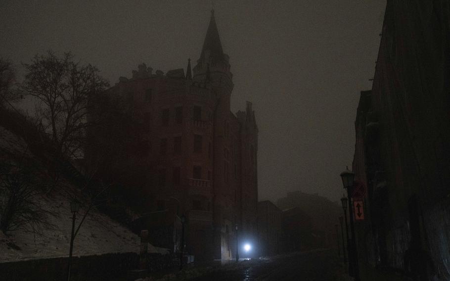 A man walks at the city center which lost electrical power after yesterday’s Russian rocket attack in Kyiv, Ukraine, Thursday, Nov. 24, 2022.