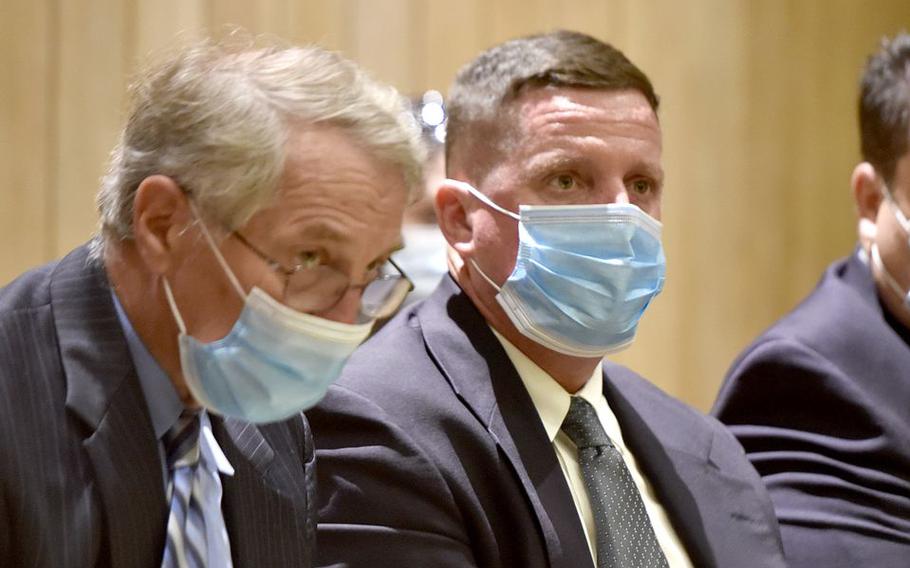 Former superintendent of the Soldiers' Home in Holyoke, Mass., Bennett Walsh (right), listens to testimony while sitting next to his attorney, William Bennett. This was a hearing in Hampden Superior Court to consider a motion to dismiss criminal charges against Walsh and former medical director, Dr. David Clinton in the criminal case brought against them by Attorney General Maura Healey, August 24, 2021.