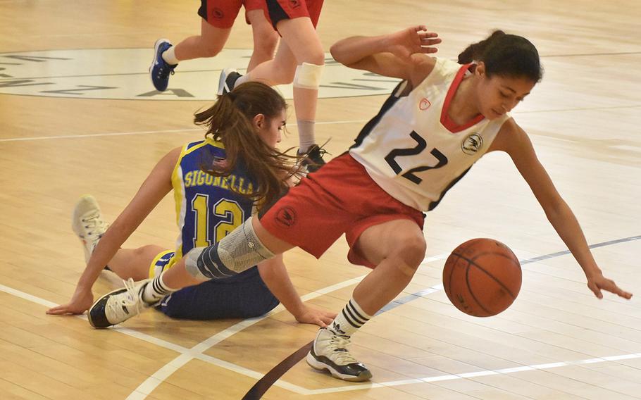 American Overseas School of Rome’s Lara Jaff goes tumbling to the floor after Sigonella’s Fabiola Mercado-Rodriguez had already landed there as the two battled for the ball in the championship game of the DODEA-Europe Division II girls title game Saturday, March 5, 2022.
