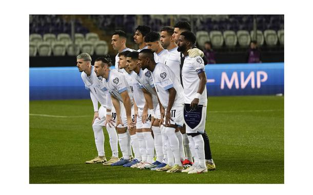Israel players pose for photographers prior to the start of the Euro 2024 qualifying play-off soccer match between Israel and Iceland, at Szusza Ferenc Stadium in Budapest, Hungary, Thursday, March 21, 2024. (AP Photo/Darko Vojinovic)