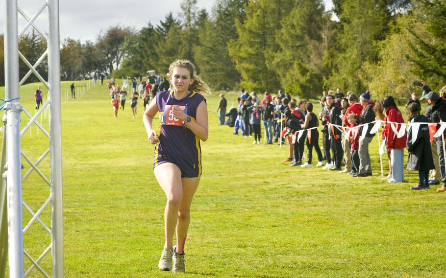 Bahrain senior Maddie Armes sprints to the finish at the girls DODEA-Europe cross country championship Oct. 21, 2023, in Baumholder, Germany.