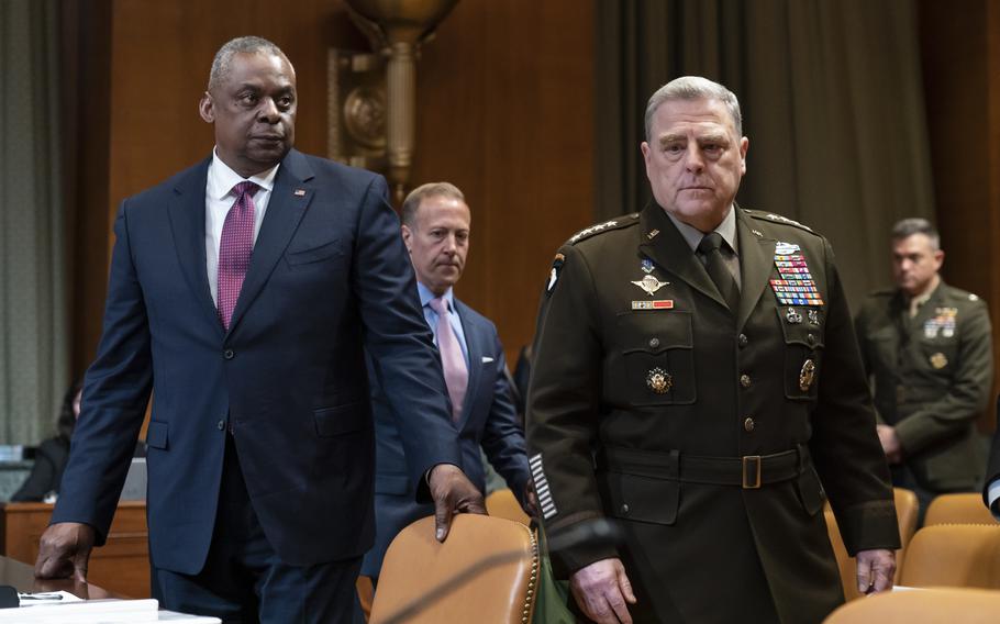 Defense Secretary Lloyd Austin, left, and Army Gen. Mark Milley, chairman of the Joint Chiefs of Staff, arrive Tuesday, May 3, 2022, on Capitol Hill in Washington to testify before the Senate Appropriations Committee about the Defense Department budget request.