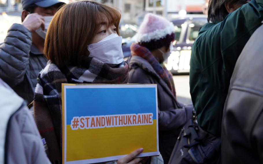 Anti-war demonstrators gather near the Russian embassy in Tokyo, Friday, Feb. 25, 2022. 