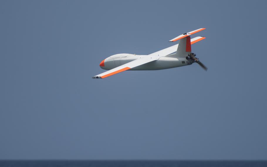 An MQM-170 Outlaw unmanned aerial vehicle soars over the water as U.S. soldiers prepare to shoot it down with a .50 caliber machine gun and Stinger missiles during a Balikatan drill at Naval Station Leovigildo Gantioqui in San Antonio, Philippines, Tuesday, April 25, 2023.