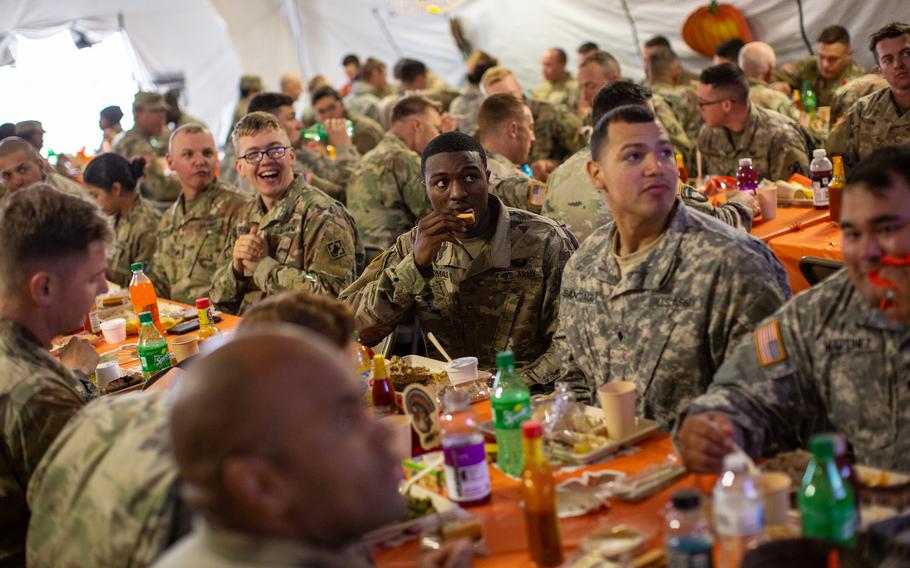 U.S. Army troops deployed to the U.S.-Mexico border eat a Thanksgiving meal at a base near the Donna-Rio Bravo International Bridge on Nov. 22, 2018, in Donna, Texas. 