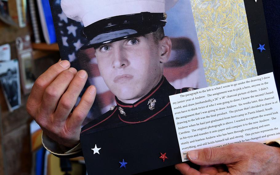 Patrick Smithwick holds a photograph of his son Andrew, who became homeless after serving two tours as a Marine in Iraq.