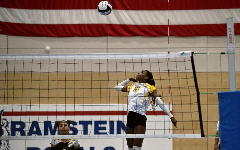 Vicenza's Alexandria Taylor jumps up to spike the ball during the Cougars' Division II semifinal against Aviano at the DODEA European volleyball championships on Oct. 27, 2023, at Ramstein High School on Ramstein Air Base, Germany.