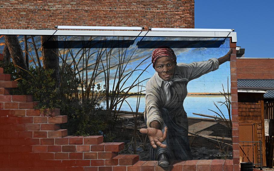 The Harriet Tubman tribute mural, “Take My Hand,” is located on the side of the Harriet Tubman Museum & Educational Center in downtown Cambridge.