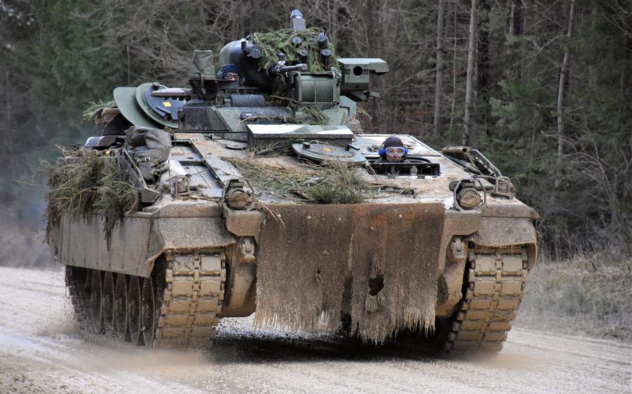 A German Marder armored personnel carrier speeds through the mud at Hohenfels Training Area, Germany, in January 2022.
