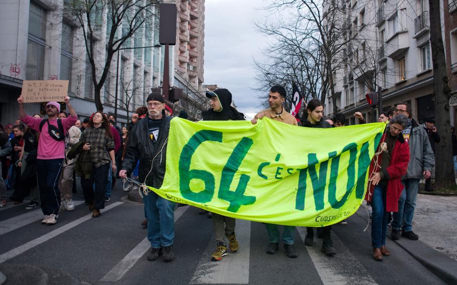 Demonstrators march along Avenue de Choisy, during a pension reform protest, in Paris, France, on Saturday, March 18, 2023. 