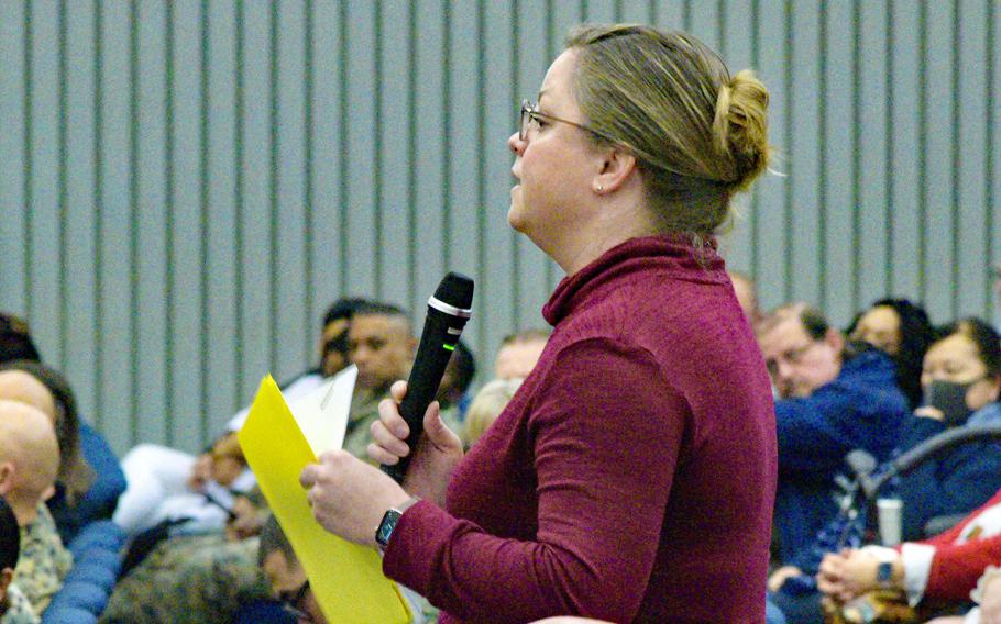 A woman asks a question about civilians' access to medical care during a town hall at Camp Foster, Okinawa, Thursday, Feb. 2, 2023.