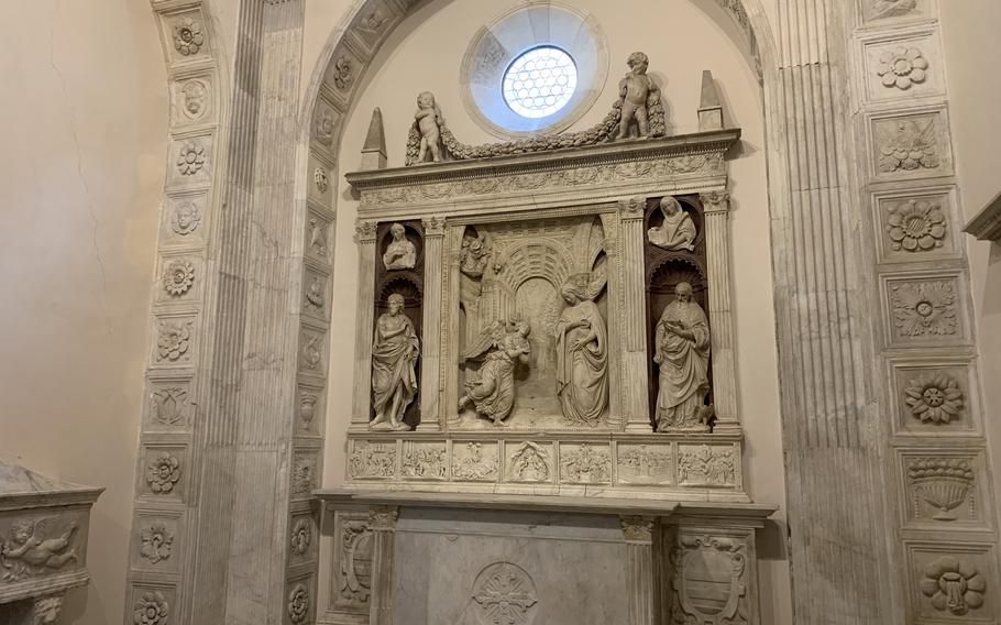 This altar in a chapel of the Complesso Monumentale Sant'Anna dei Lombardi in Naples was crafted by Benedetto de Maiano, a sculptor from Florence. Historians believe an angel at the top right of the altar is the early work of Michelangelo.