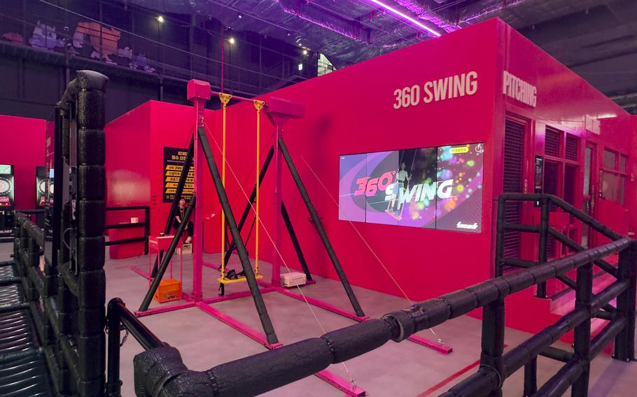 A brightly colored, huge indoor swing is capable of making a 360-degree rotation.