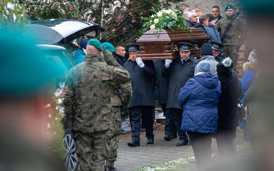 Pallbearers in Przewodow, Poland, on Nov. 19, 2022, carry the coffin of Boguslaw Wos, one of two Polish men killed in a missile explosion believed to have been caused by a Ukrainian air defense missile that went astray as the country was defending itself against a barrage of Russian missiles.
