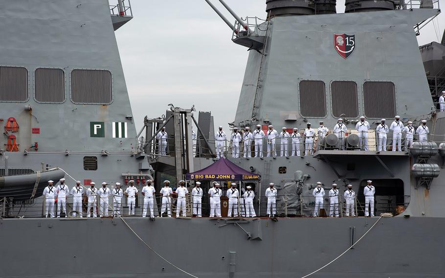 The USS John S. McCain departs Yokosuka Naval Base, Japan, Friday, Sept. 17, 2021. The guided-missile destroyer is shifting its homeport to Naval Station Everett, Wash., after 24 years in the Far East.