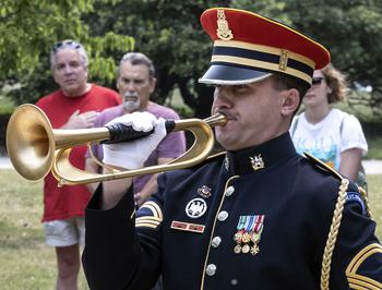 Bugler Sgt. 1st Class Jeffrey Northman plays taps at the National World War II Memorial in Washington, D.C., on the 79th anniversary of the start of the D-Day invasion, Tuesday, June 6, 2023.