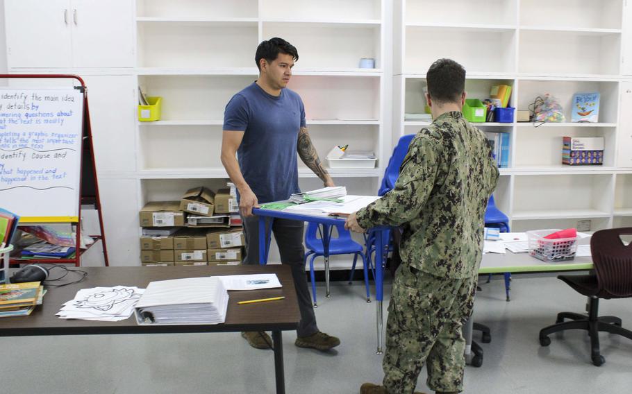 Sailors assigned to Naval Support Activity Bahrain renovate a classroom in Juffair, Bahrain, on April 23, 2024. Juffair is the site of the 24-acre campus of Bahrain Elementary, Middle and High School, which closed April 16 because of extensive water damage from a major rainstorm.