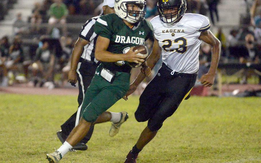 Kubasaki quarterback A.J. Millette tries to elude Kadena defensive end Jeremiah Lewis.