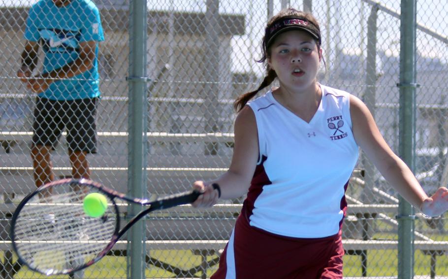 Matthew C. Perry's Julie Apperson hits a forehand return against Nile C. Kinnick's Emily Paul during Saturday's tennis matches. Paul won 8-1. Apperson later teamed with Nina Altig; the pair lost to Kinnick's Alise Walker and Olivia Laron 8-4 in doubles.