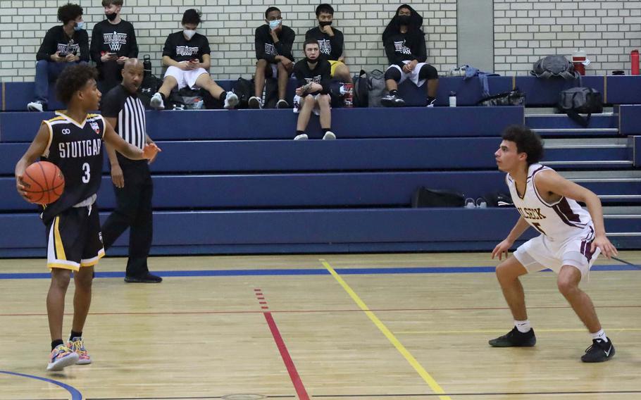 Stuttgart's Tyler Jackson, left, prepares to move with the basketball during a game at against Vilseck High School on Friday, Jan. 7, 2022, at Vilseck, Germany.