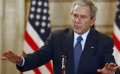 FILE - U.S. President George W. Bush, reacts, after shoes were thrown at him, by a correspondent, during a joint press conference with Iraq Prime Minister Nouri al-Maliki, not seen, in Baghdad, Iraq, Dec. 14, 2008.  Bush is facing criticism after mistakenly describing the invasion of Iraq — which he led as commander in chief — as “brutal” and “wholly unjustified,” before correcting himself to say he meant to refer to Russia’s invasion of Ukraine. He added, “Iraq, too — anyway.” The 75-year-old former president made the comment during a speech Wednesday night in Dallas, jokingly blamed the mistake on his age.  (AP Photo/ Thaier al-Sudani, Pool, File)