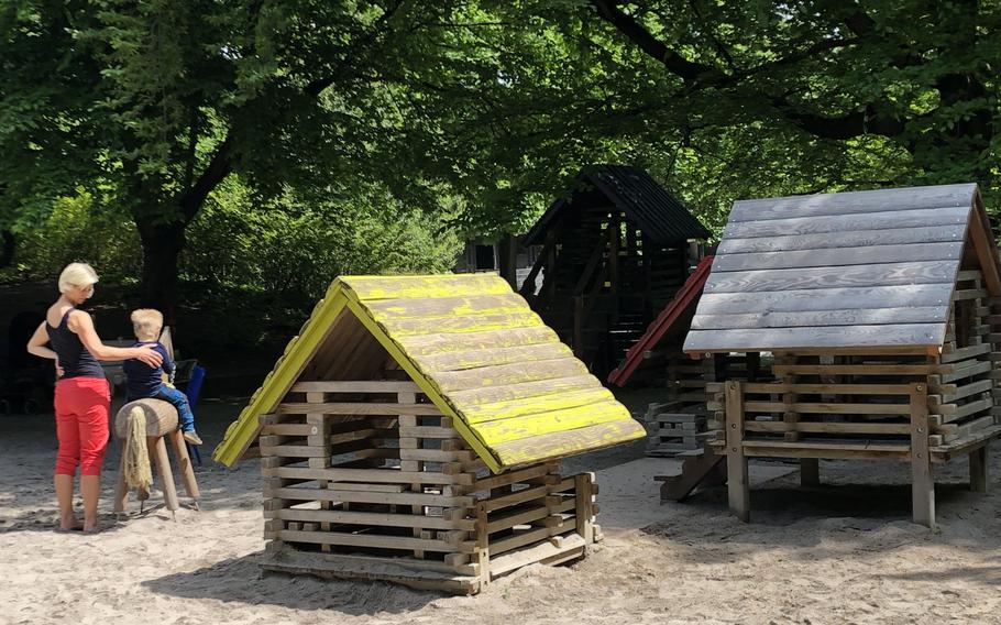 One of the playgrounds at Luisenpark in Mannheim, Germany, has wooden houses and wooden cars for children to climb on.