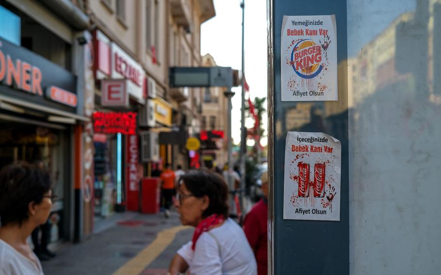 Stickers reading “Baby blood in your drink!” are being used to protest against Coca Cola, while stickers saying “Baby blood in your food!” are being used to protest against Burger King, in Izmir, Turkey, on Nov. 7, 2023. The boycotts are on all American and Israeli brands as a solidarity with Palestinian.