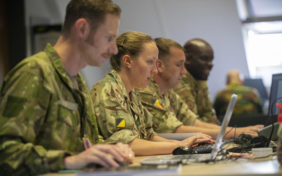 EUCOM Control Center Ukraine staffers from the United Kingdom and United States arrange weapons deliveries to Ukraine from an office at Patch Barracks in Stuttgart, Germany, on June 3, 2022.