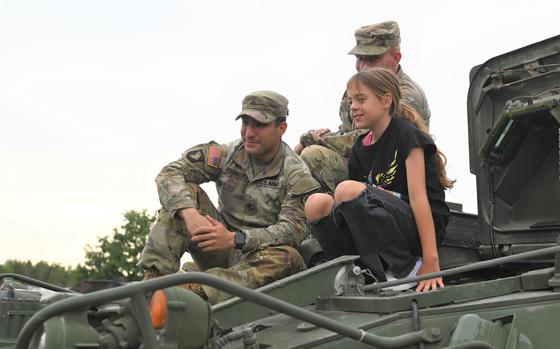 Service members take turns showing military vehicles, helicopters, and equipment to attendees for the German-American Volksfest held on August 5th, 2023, in Camp Algiers, Grafenwoehr, Germany.