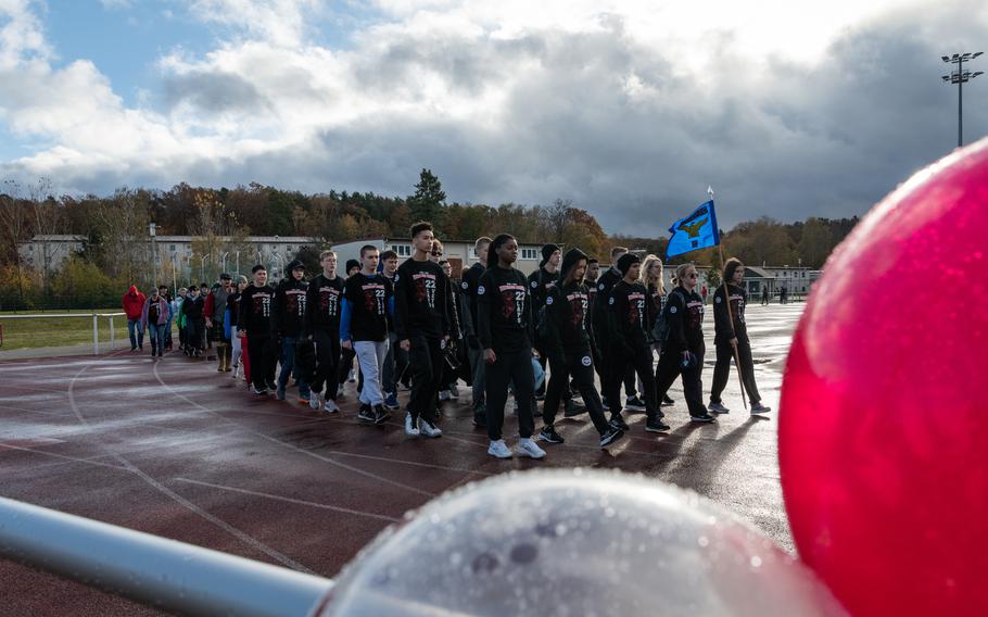 Air Force JROTC cadets from Kaiserslautern and Ramstein High School make their way around the track at Kaiserslautern High School 22 times, as part of a Veterans Day march on Friday, Nov. 10, 2023.