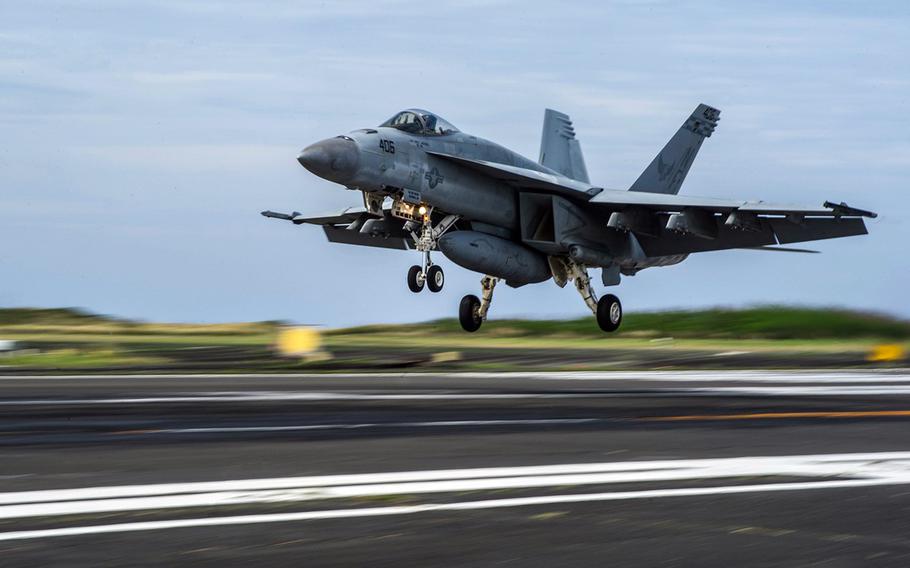 An F/A-18E Super Hornet assigned to Carrier Air Wing 5 prepares to land during field carrier landing practice in May 2014 on Iwo Jima, Japan.