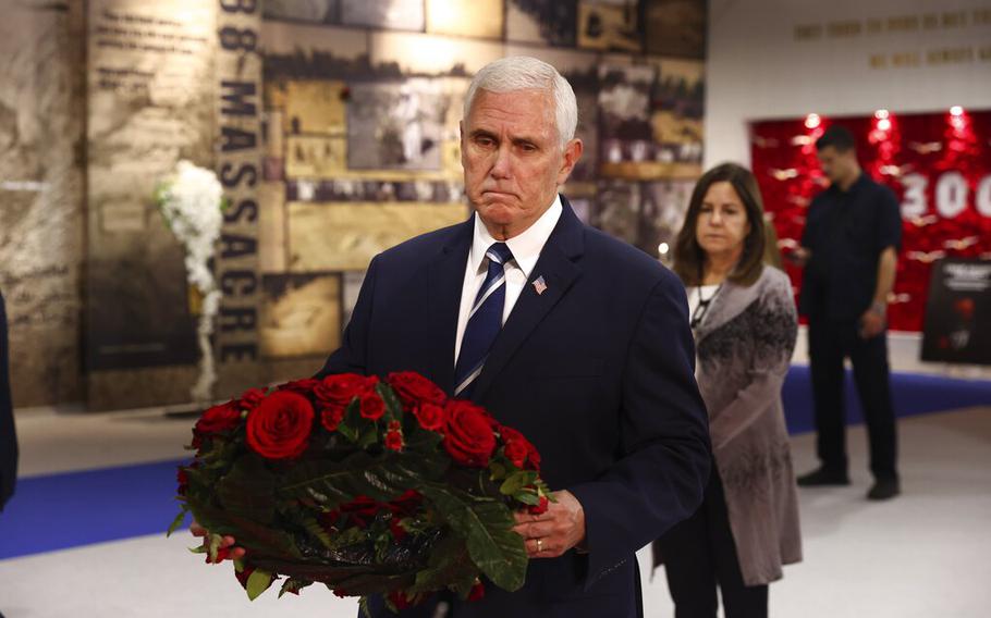 Former U.S. vice president Mike Pence lays a wreath during his visit to the Iranian opposition headquarters in Albania, about 16 miles west of Tirana, Albania, Thursday, June 23, 2022.