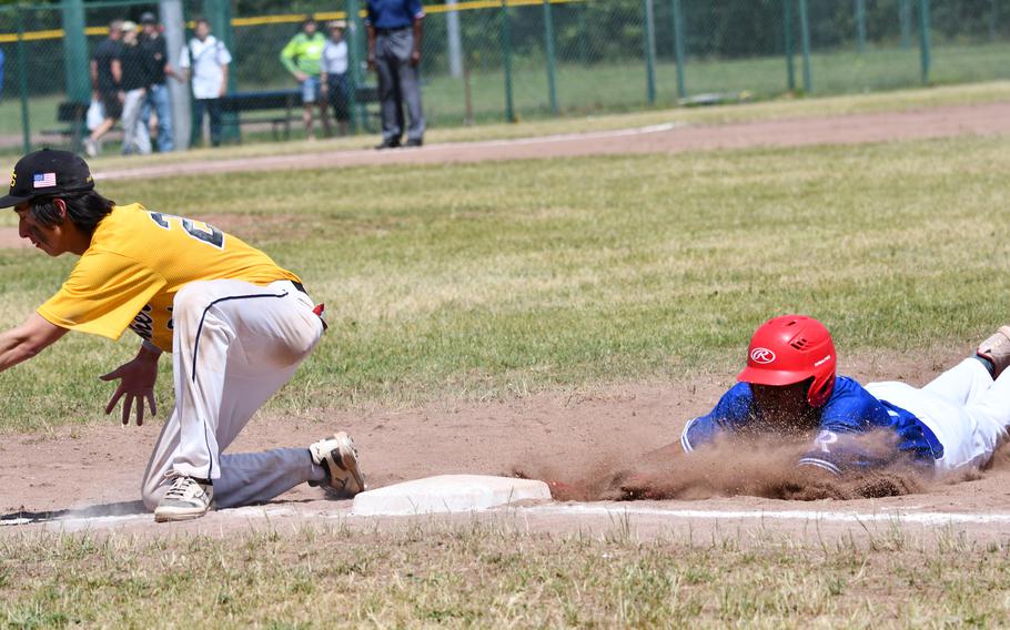 Ramstein’s Rueben Todman dives back into first after an attempted pickoff by the Stuttgart catcher during the Division I title game in the 2022 DODEA-Europe baseball championships.