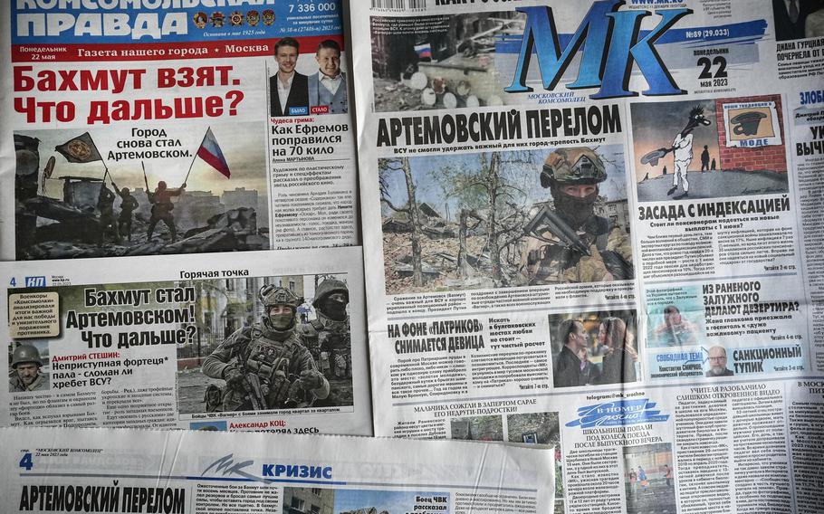 A combo of Russian national newspapers on Monday, May 22, 2023, all leading with news on the taking of control of the city of Bakhmut, after the longest and most grinding battle, in Moscow, Russia, Monday, May 22, 2023. Despite the Russian claims, top Ukrainian military leaders say the fight there is not over, even though they still control only a small part of the city. 