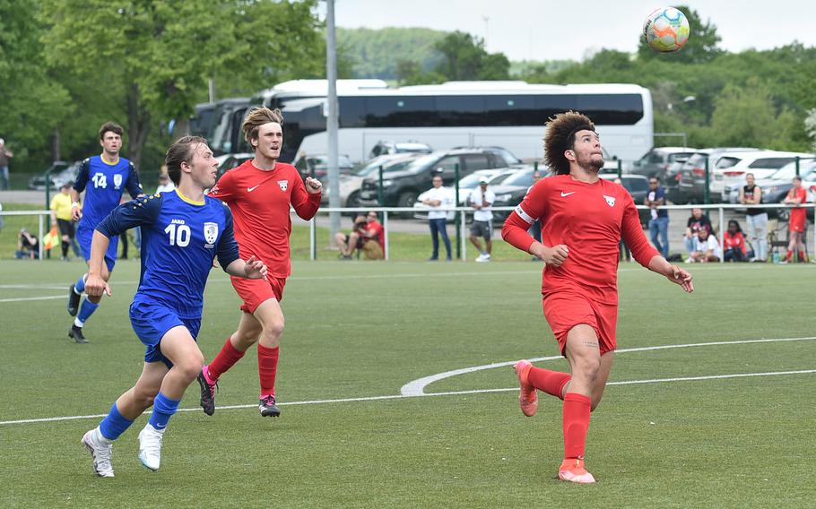 Kaiserslautern defender Jackson Armstrong eyes a ball to clear during a pool play match against Wiesbaden on May 15, 2023, in Reichenbach-Steegen, Germany. Trailing the play at left is the Warriors' Asher Anderson.