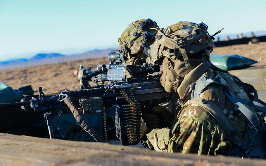 3rd Infantry Division soldiers man fighting positions inside a trench during a force-on-force battle at the Army’s National Training Center at Fort Irwin in California’s Mojave Desert on Feb. 27, 2023. 