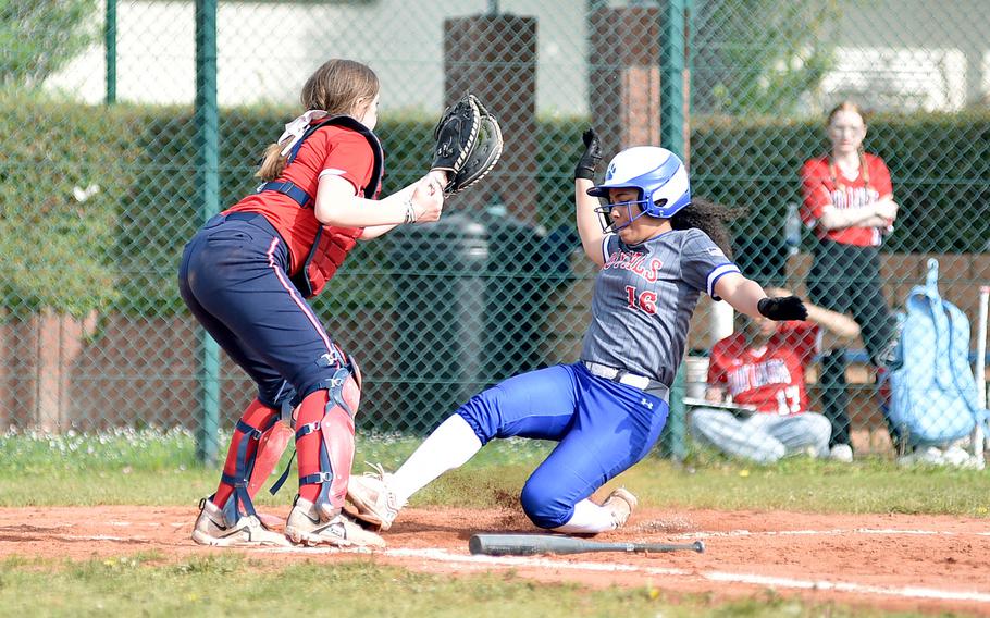 Ramstein's Ania Edwards is forced out at the plate by Lakenheath catcher Lalaine Toms during the first game of an April 13, 2024, doubleheader on Ramstein Air Base, Germany.