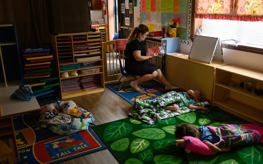 Chelsea Hallinan, 37, organizes children's take-home packets while they nap at the Begin With Us Pre-K Center in Altoona, Pa. 